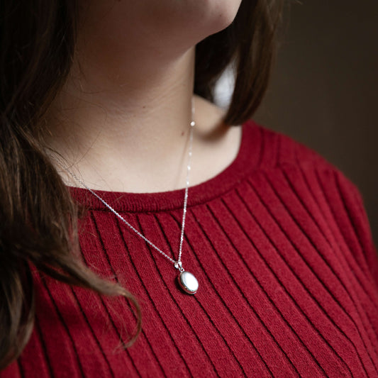 Model wearing petite silver locket