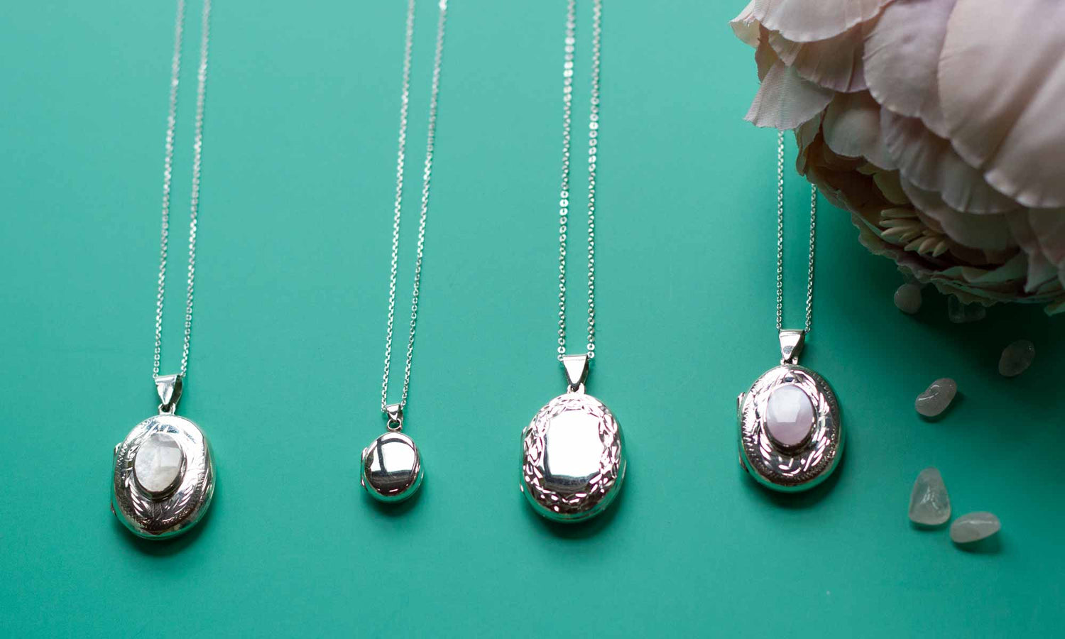 silver oval locket collection on a blue background