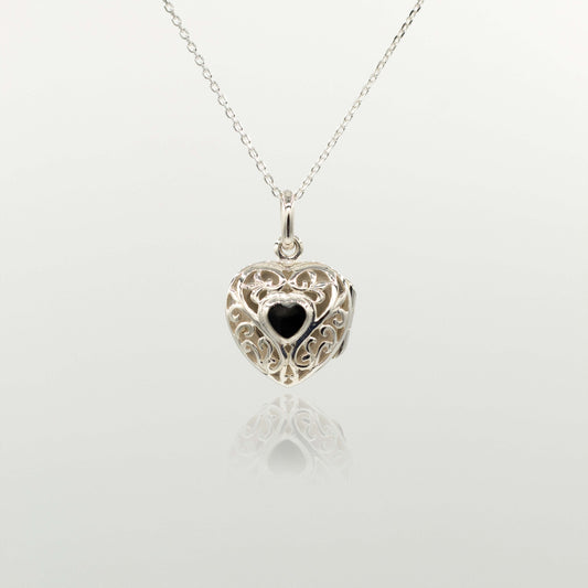 Locket necklace on a silver chain against white background