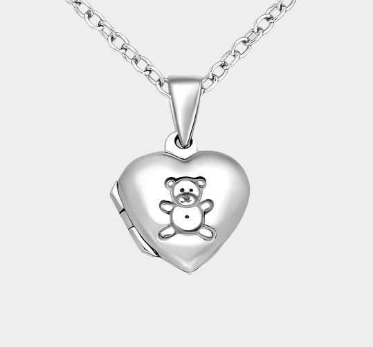 Tiny childrens silver locket with teddy bear on a chain. 
