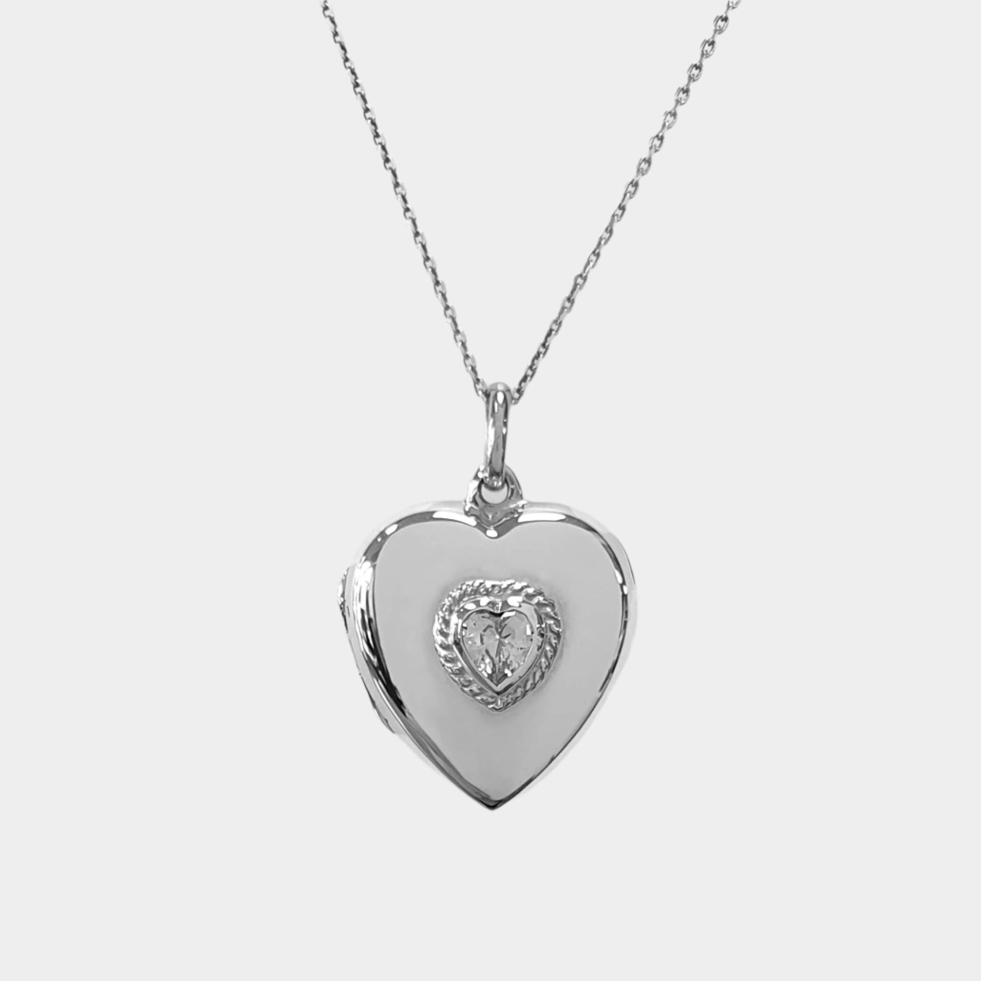 heart shaped photo locket with cubic zirconia on white background