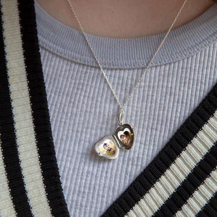heart locket open showing photos