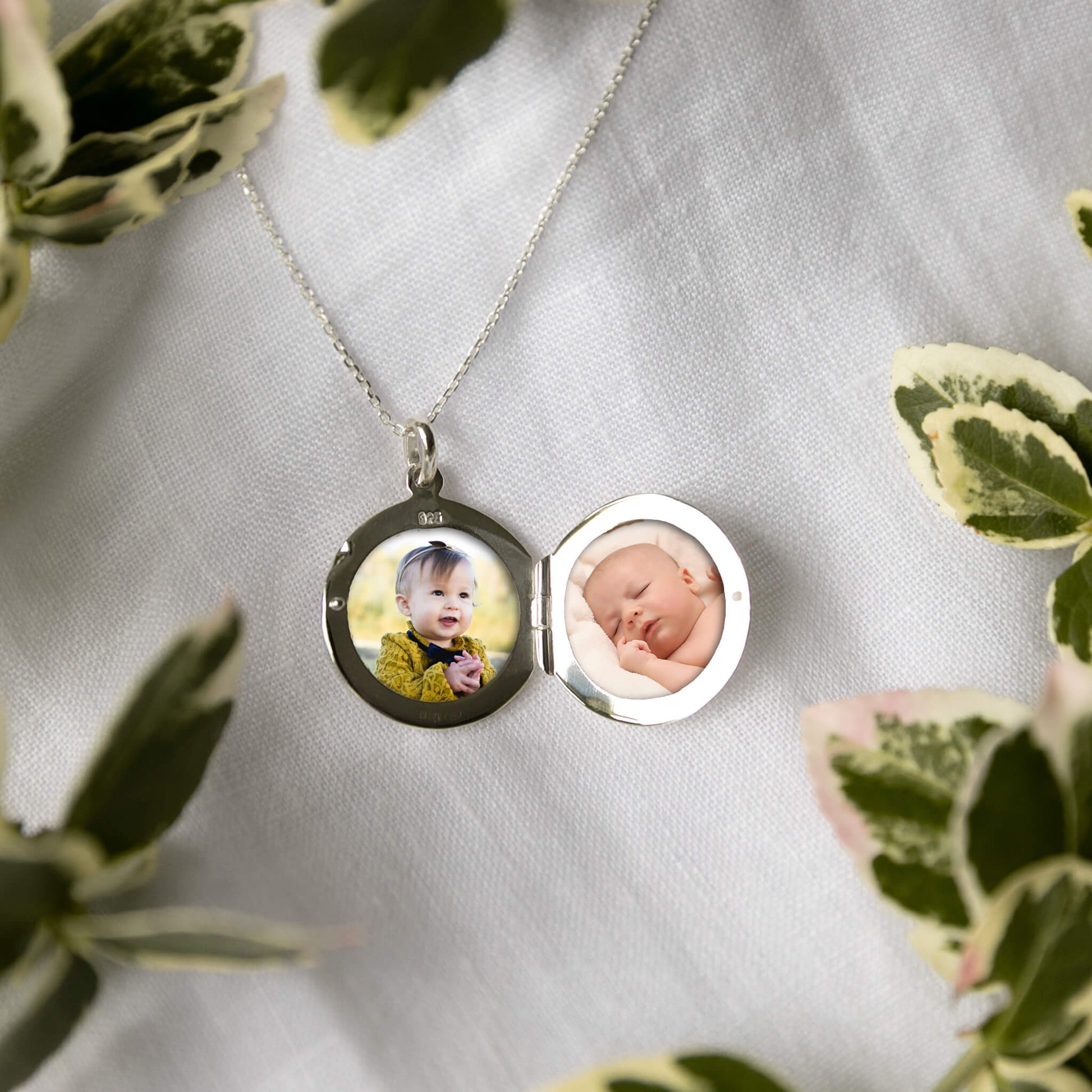 round photo locket showing two photos
