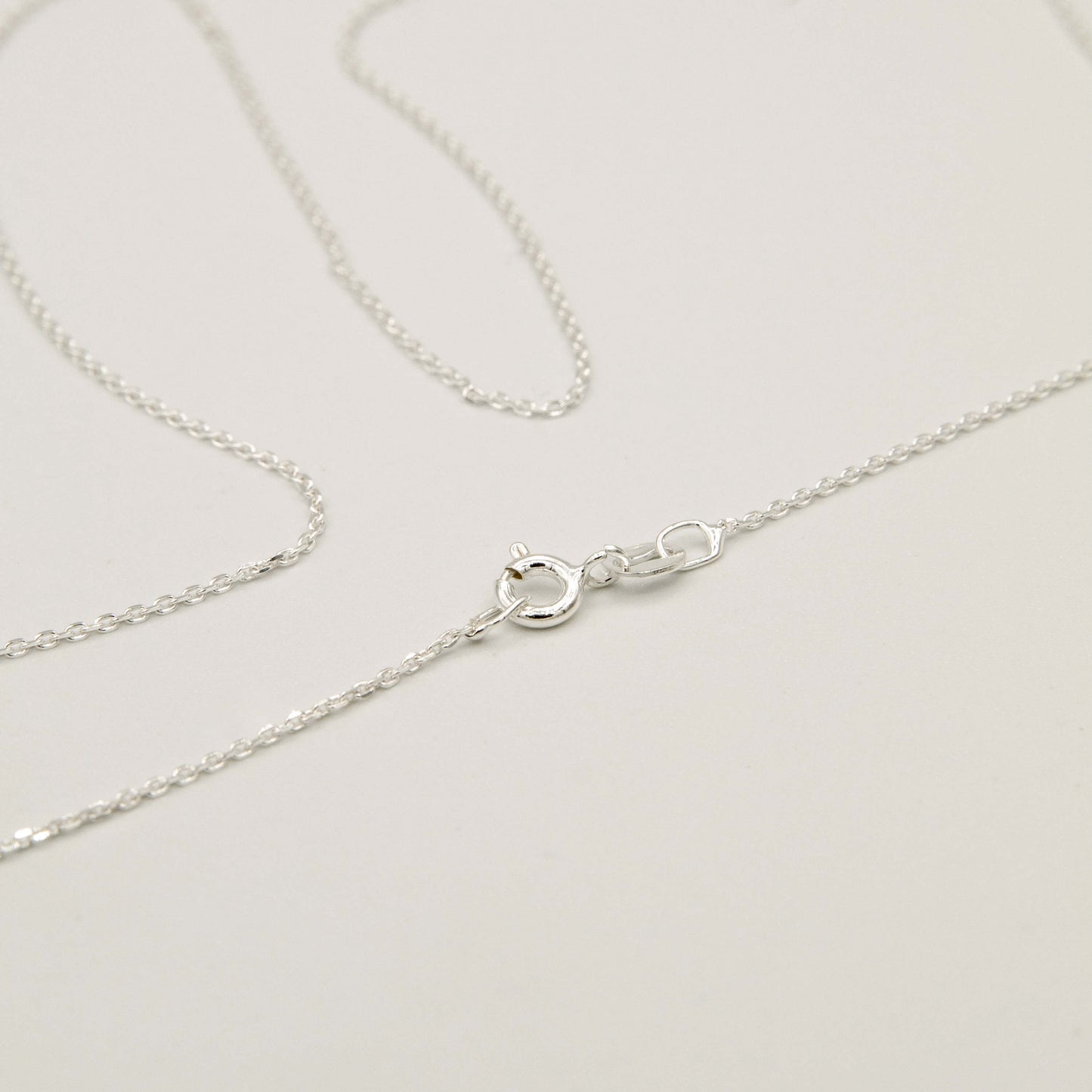 silver chain on a whitew background