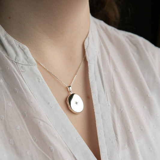 model wearing oval silver locket