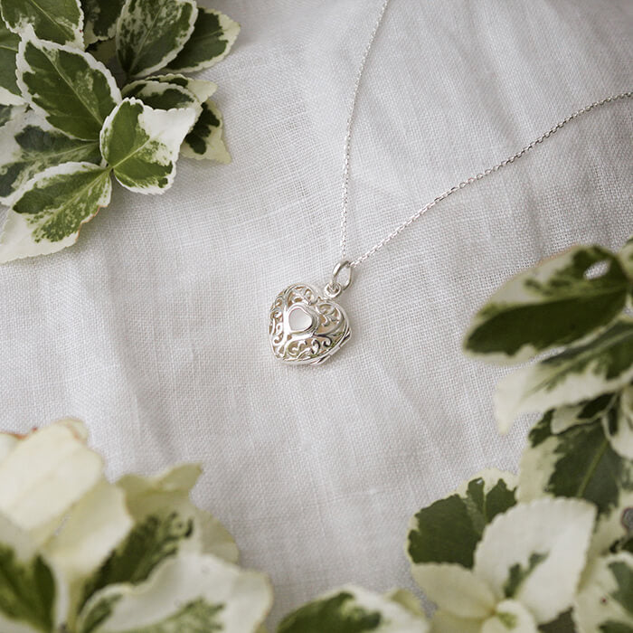 silver locket on white klinen