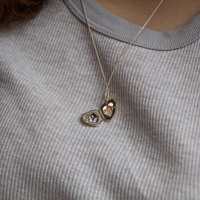 model wearing silver locket open