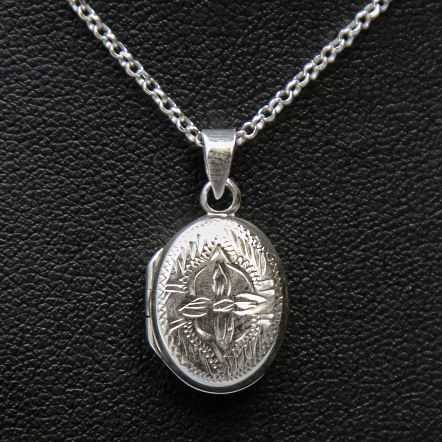 Locket necklace with locket pendant with lily motif on Italian silver chain