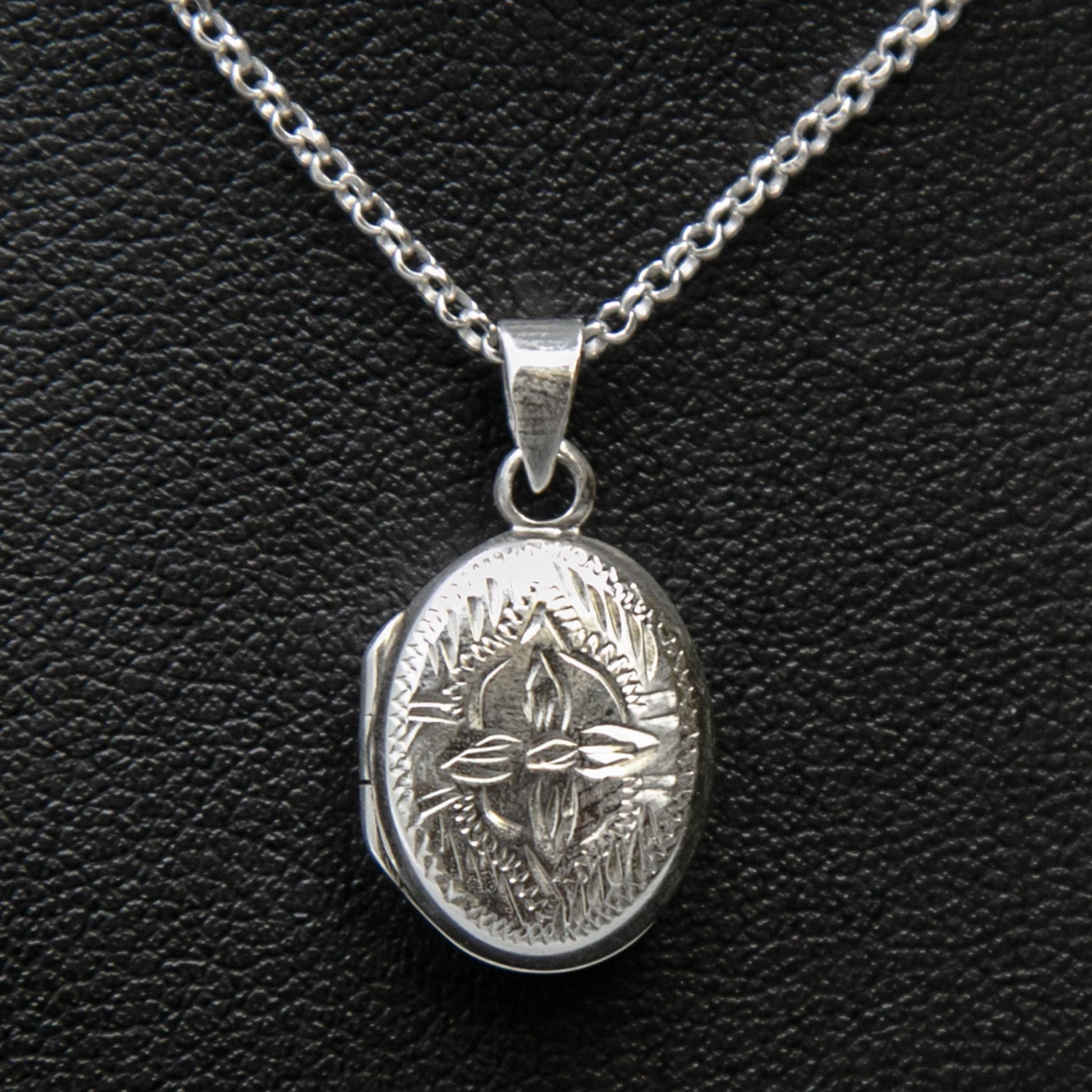 Locket necklace with locket pendant with lily motif on Italian silver chain